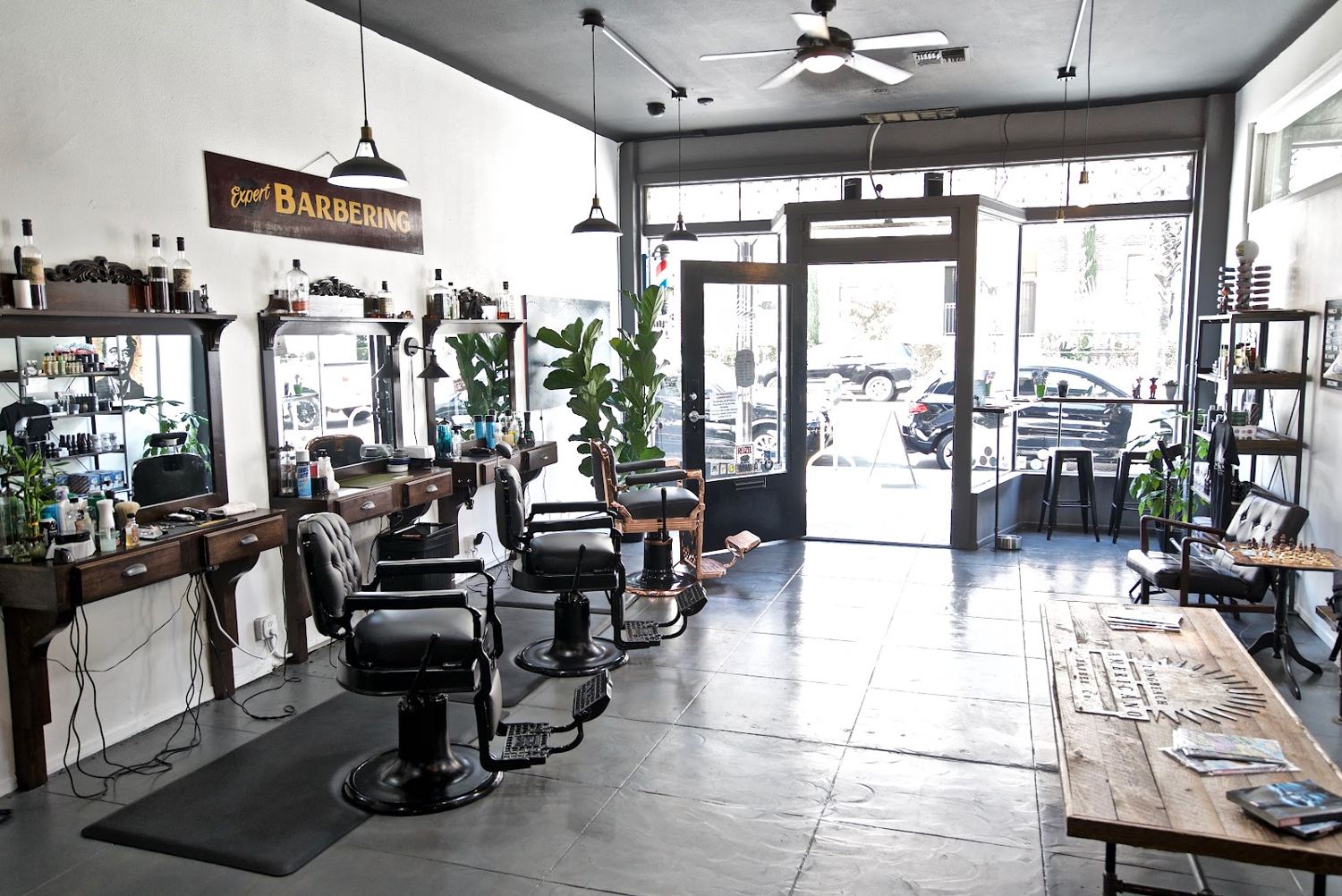 Inside Americano Barber Co. looking out at E 4th St