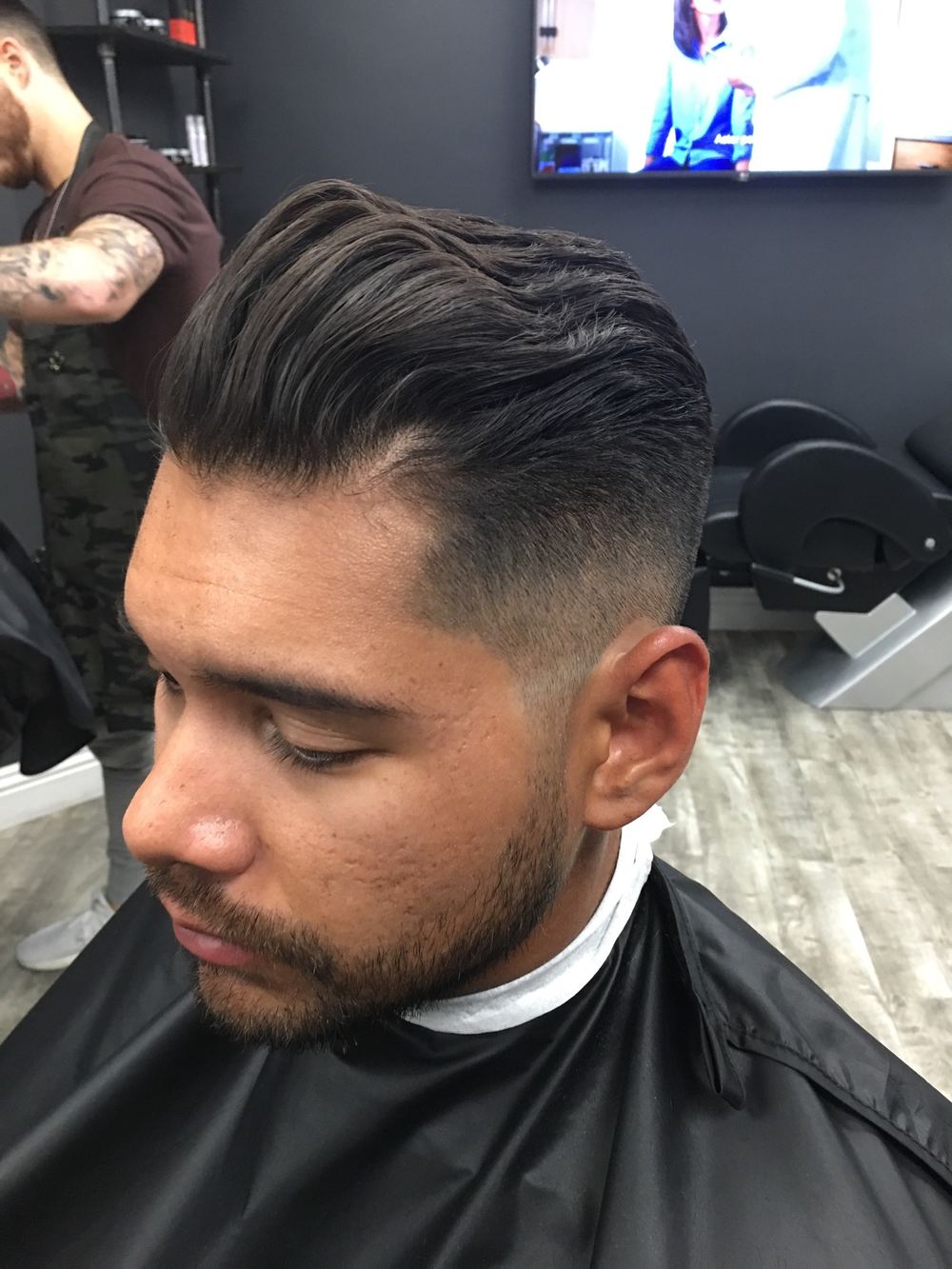 A pompadour with a clean fade