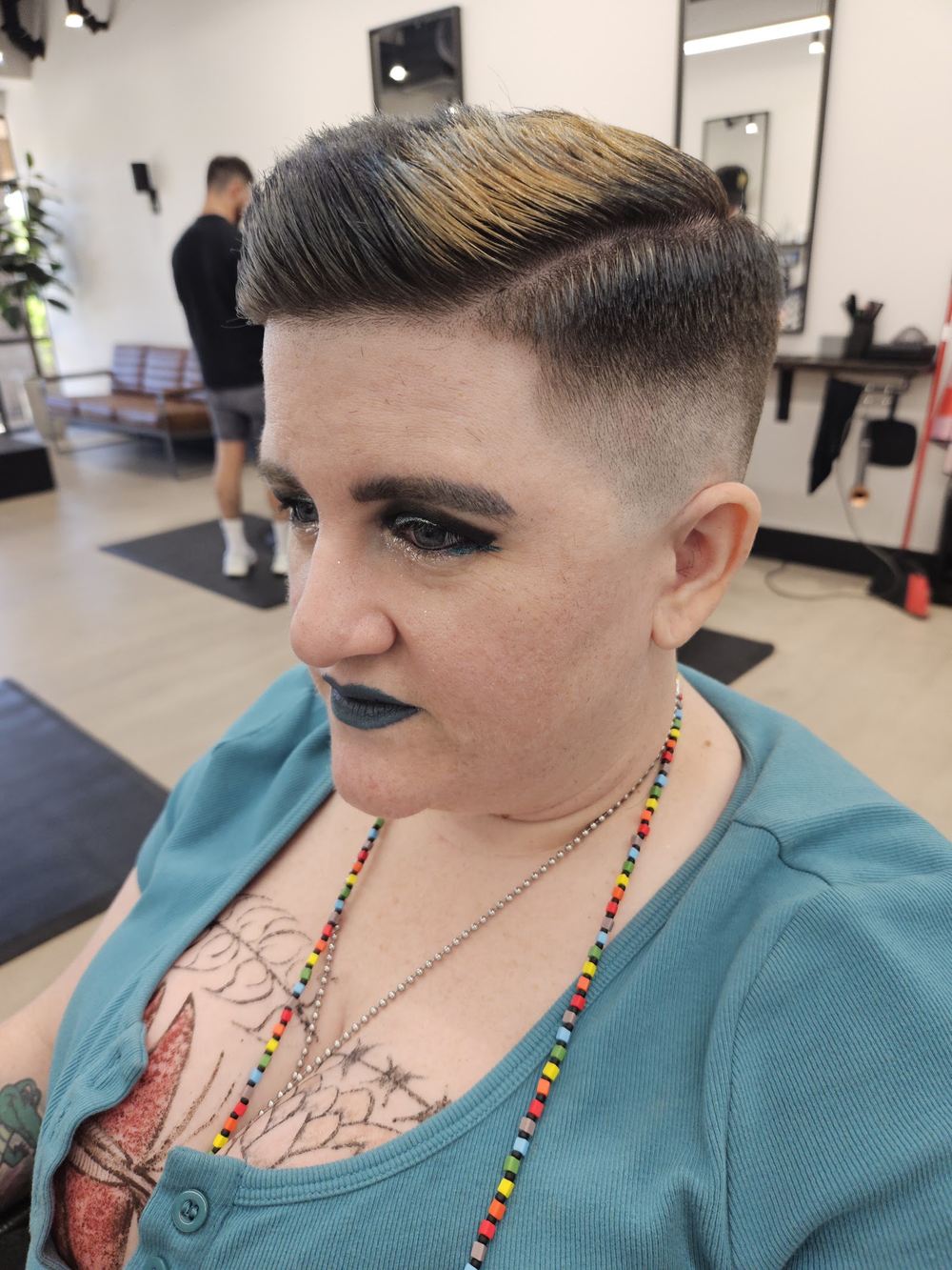 A styled cut with a hard part