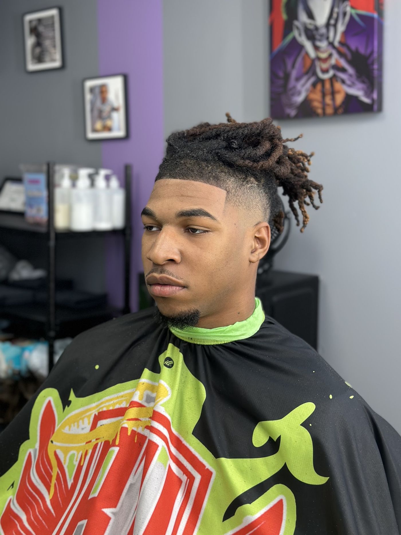 A fresh fade with locs, cut in the Blessedwristz studio