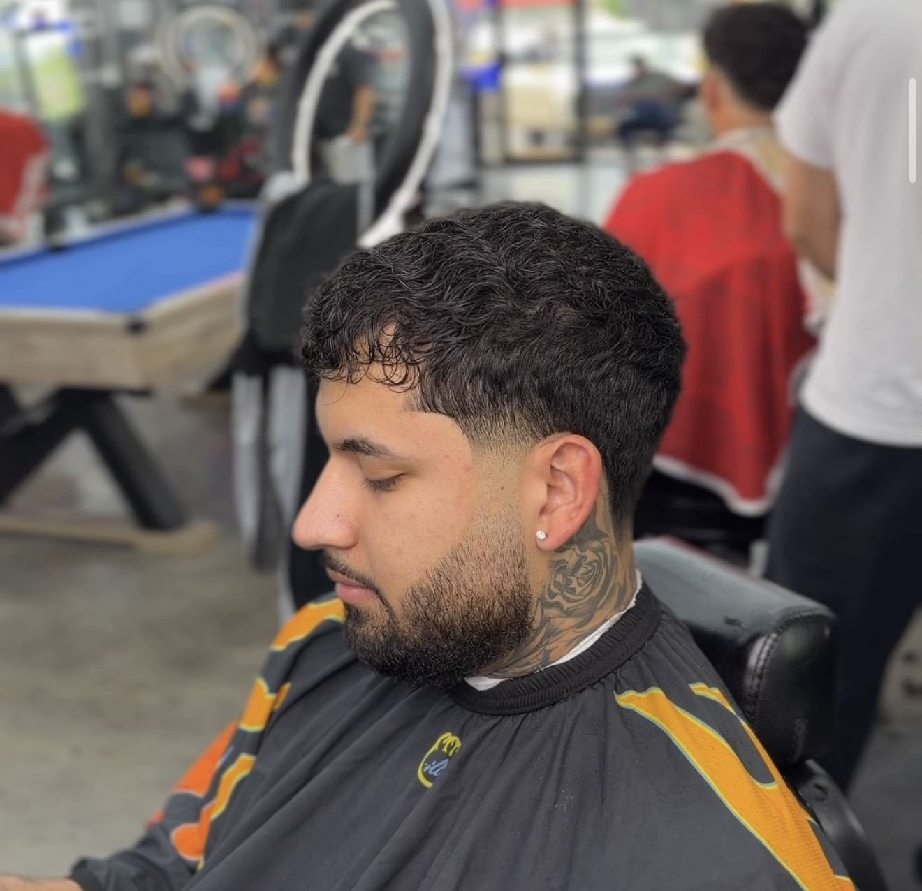 A mullet fade in progress at the chair