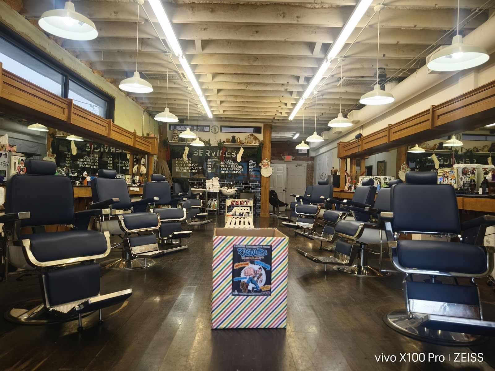 The wood-paneled floor at East End Barber, Houston