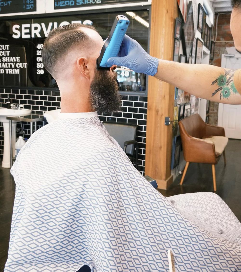 A shave at the black tile station