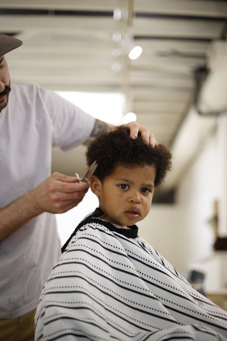A young client's curly cut