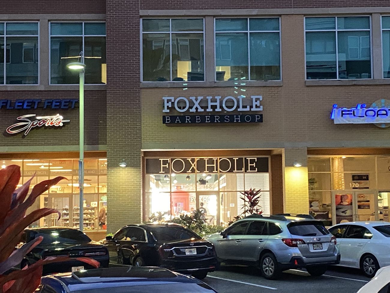 The Foxhole Barbershop storefront on W Crystal Lake St