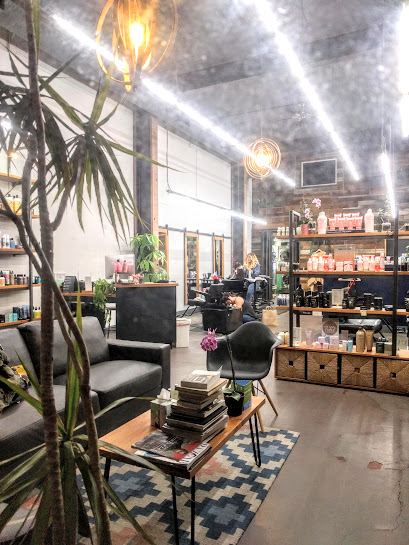 The lounge with plants, books and pendant lights