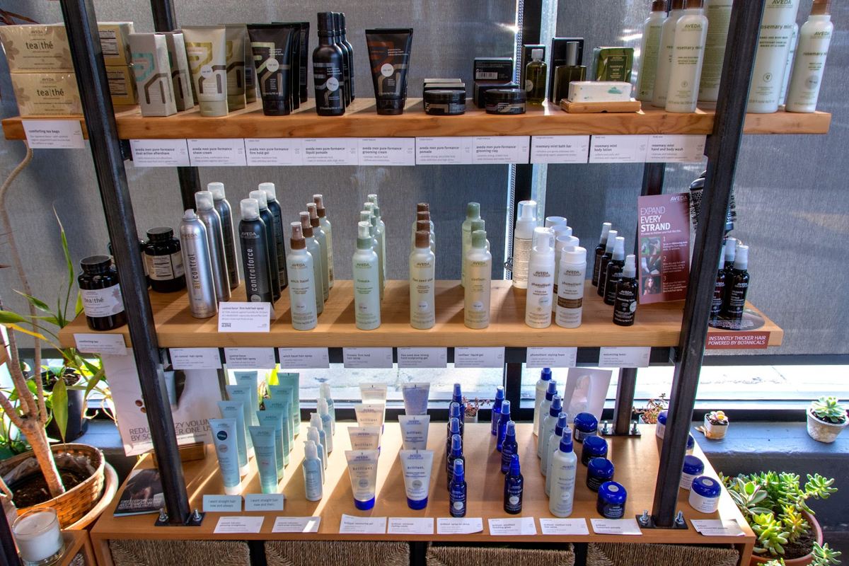 Davines products on the wood shelves