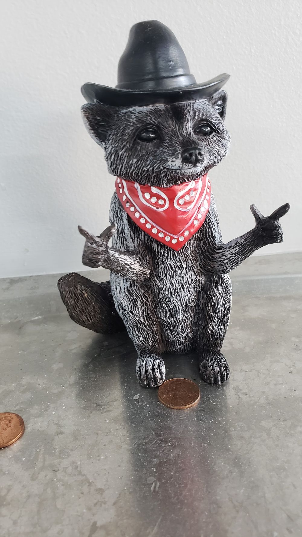 The shop's cowboy raccoon keeping watch
