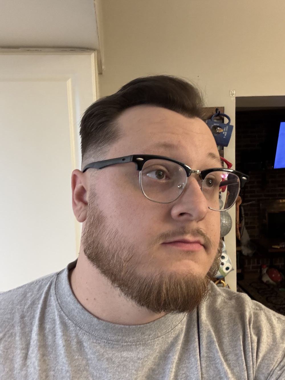A shaped beard and glasses
