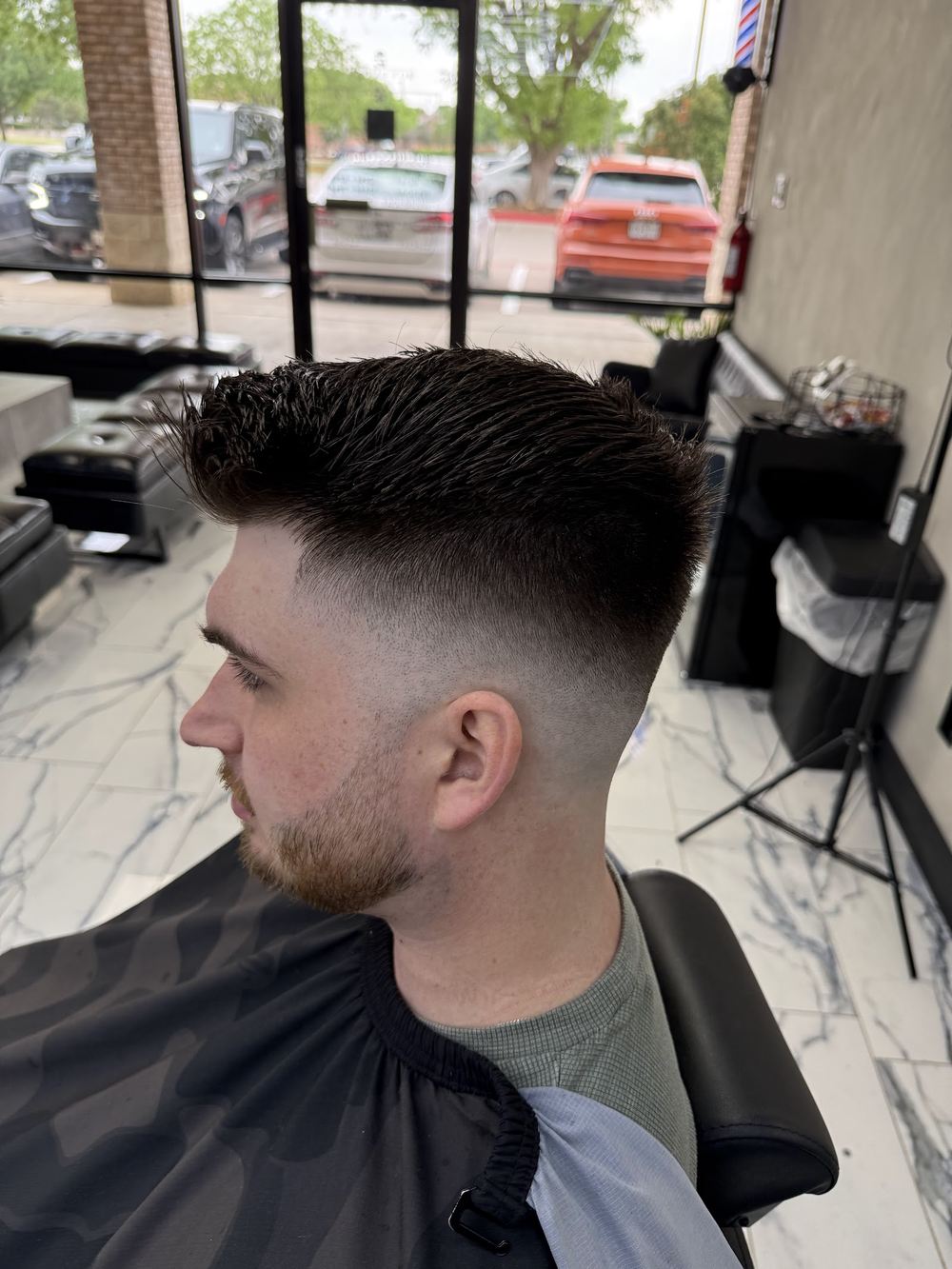 A clean skin fade with a pomp
