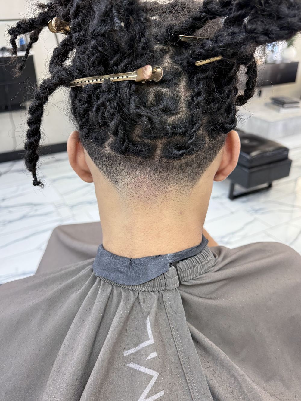 Braids tied up with a taper