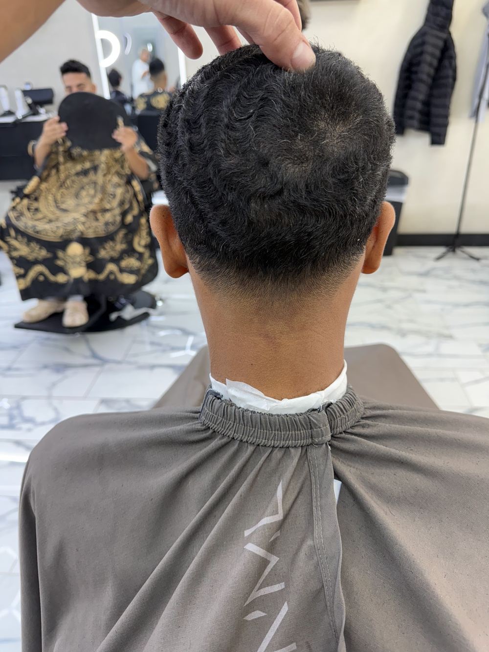 A tight round cut from behind