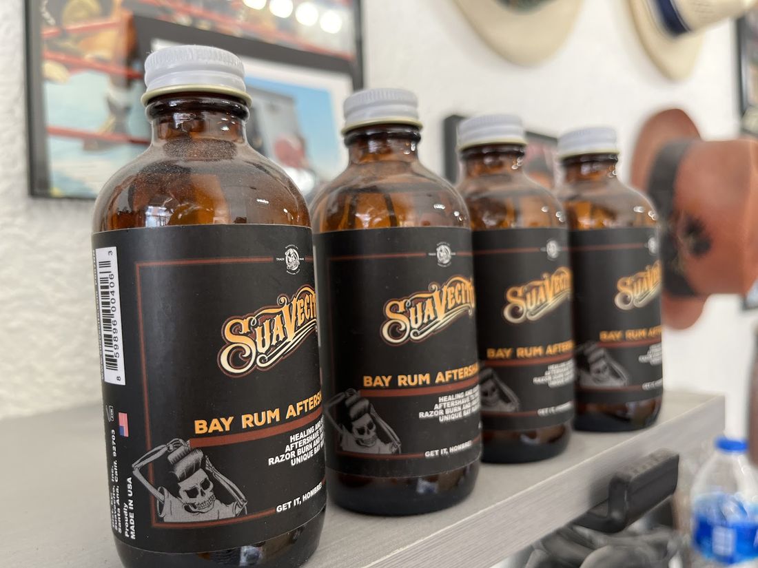 Bay rum aftershave bottles lined up at Ralph's