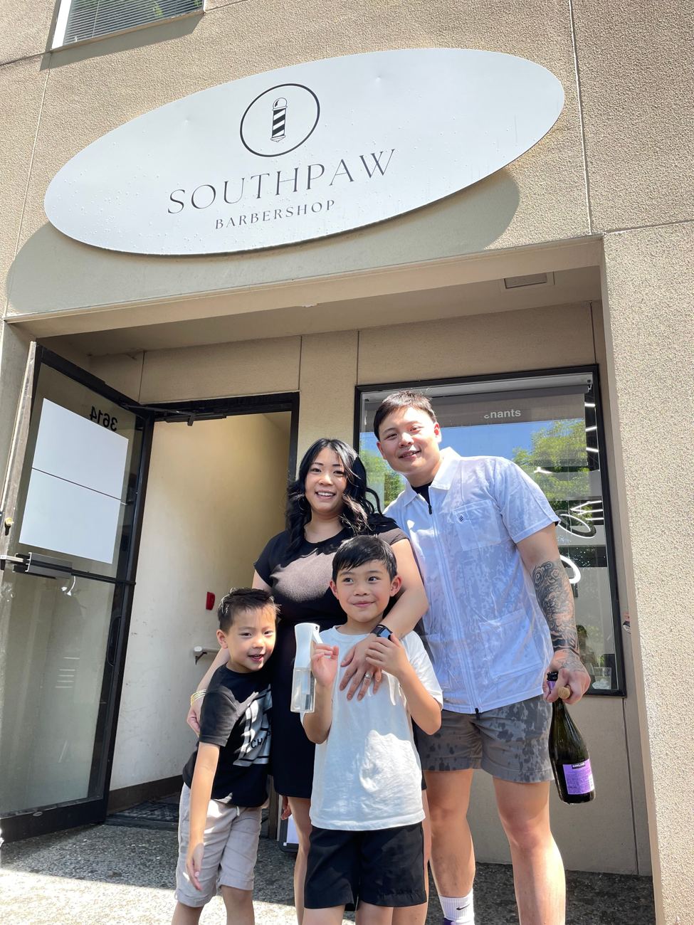 The Southpaw Barbershop sign at the front door