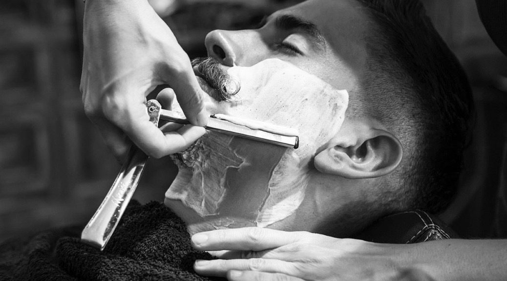 A straight razor shave in progress